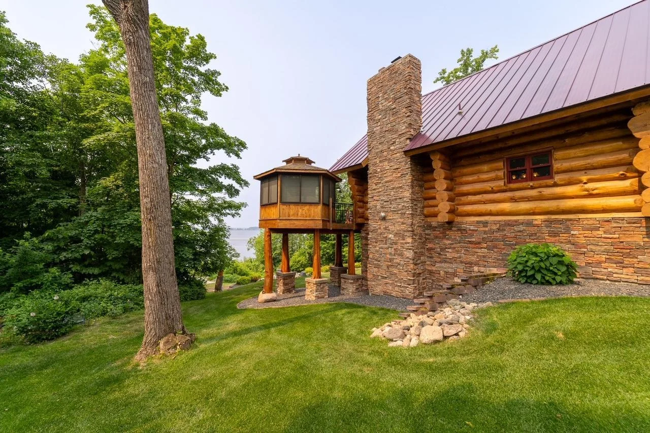 View of stone chimney and gazebo