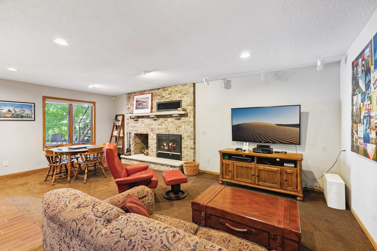 Lower level family room with wood burning fireplace.