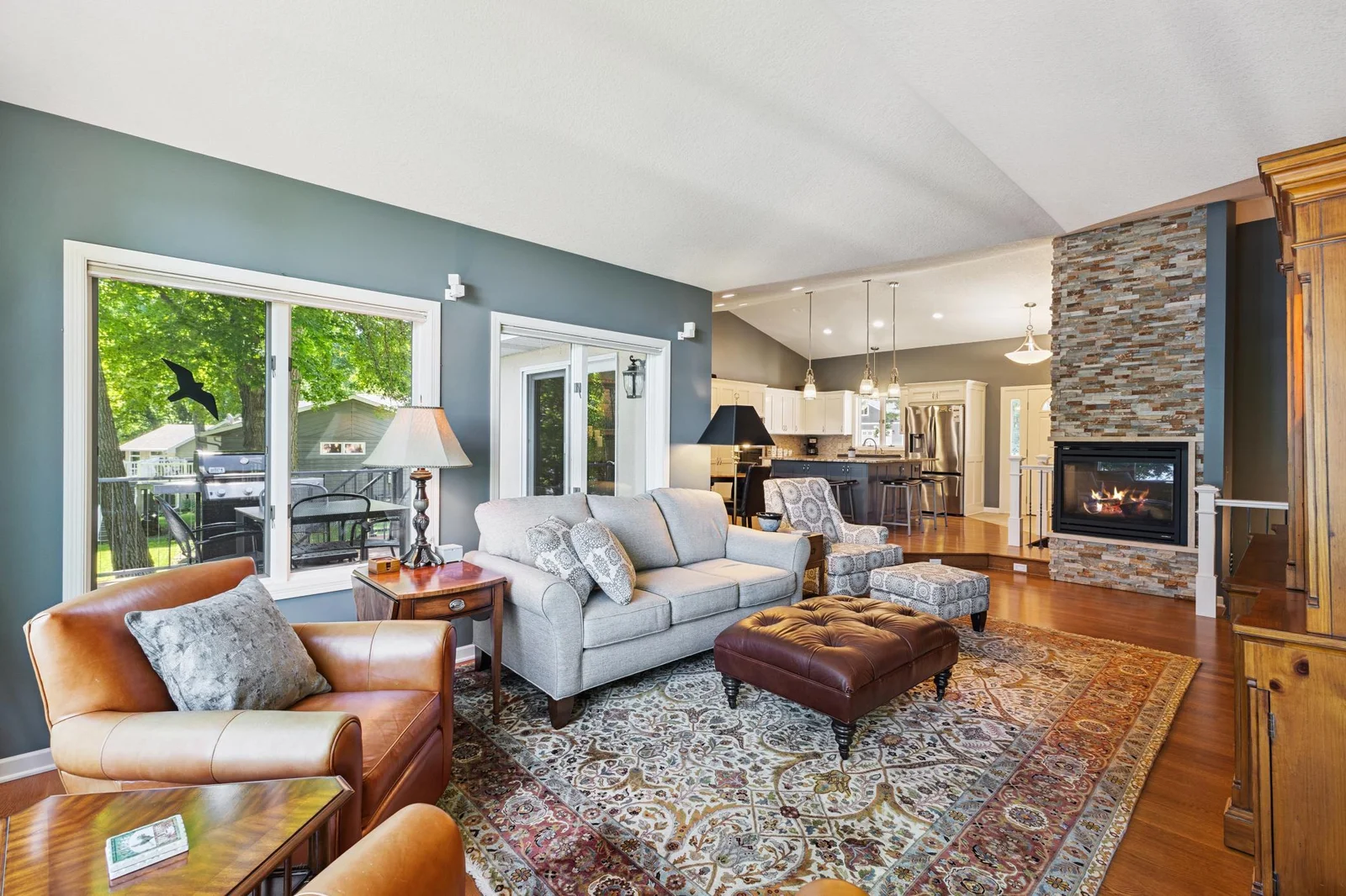 Attractive corner gas fireplace with stone surround