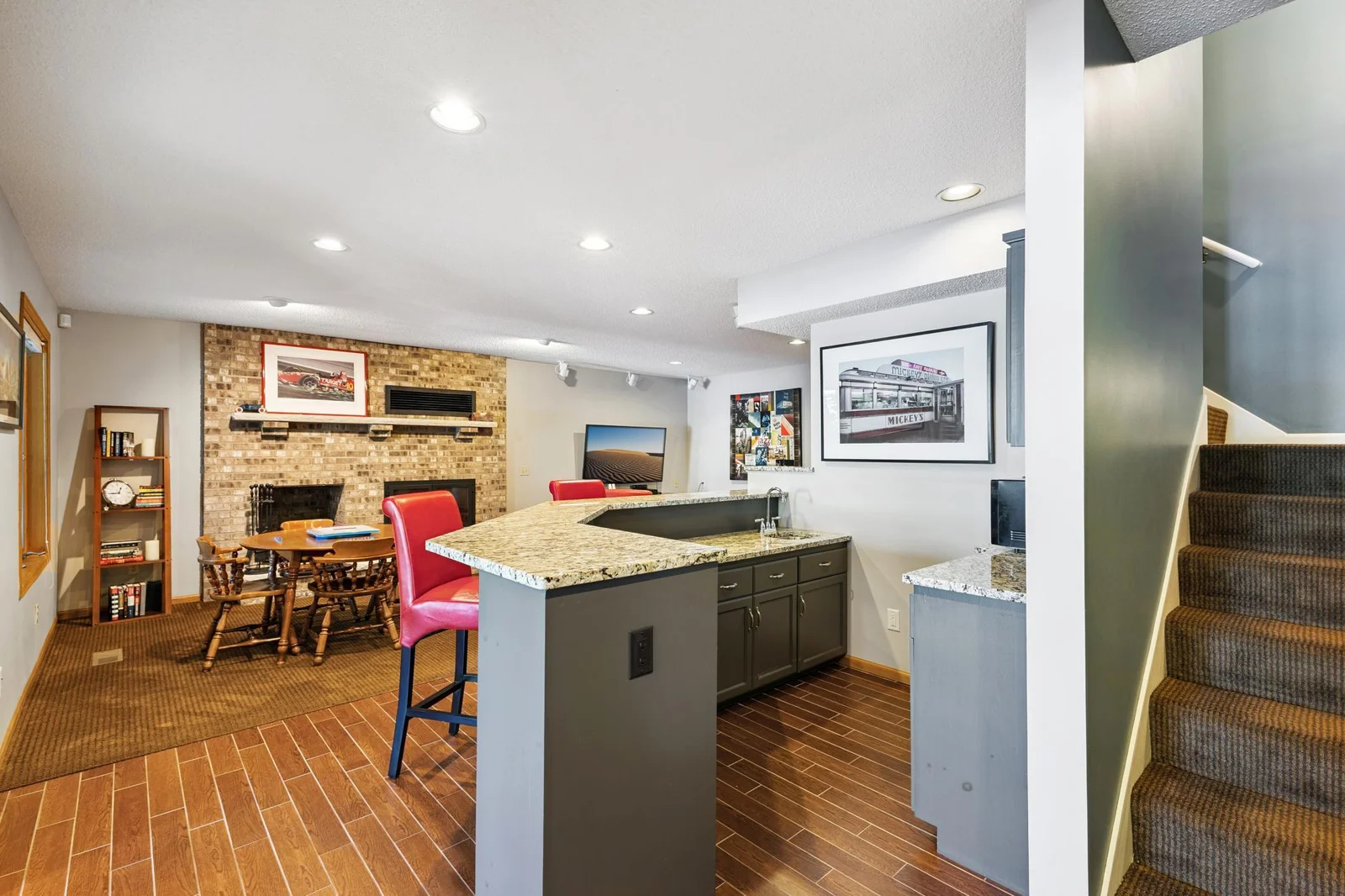 Granite on the countertop and ceramic tile.