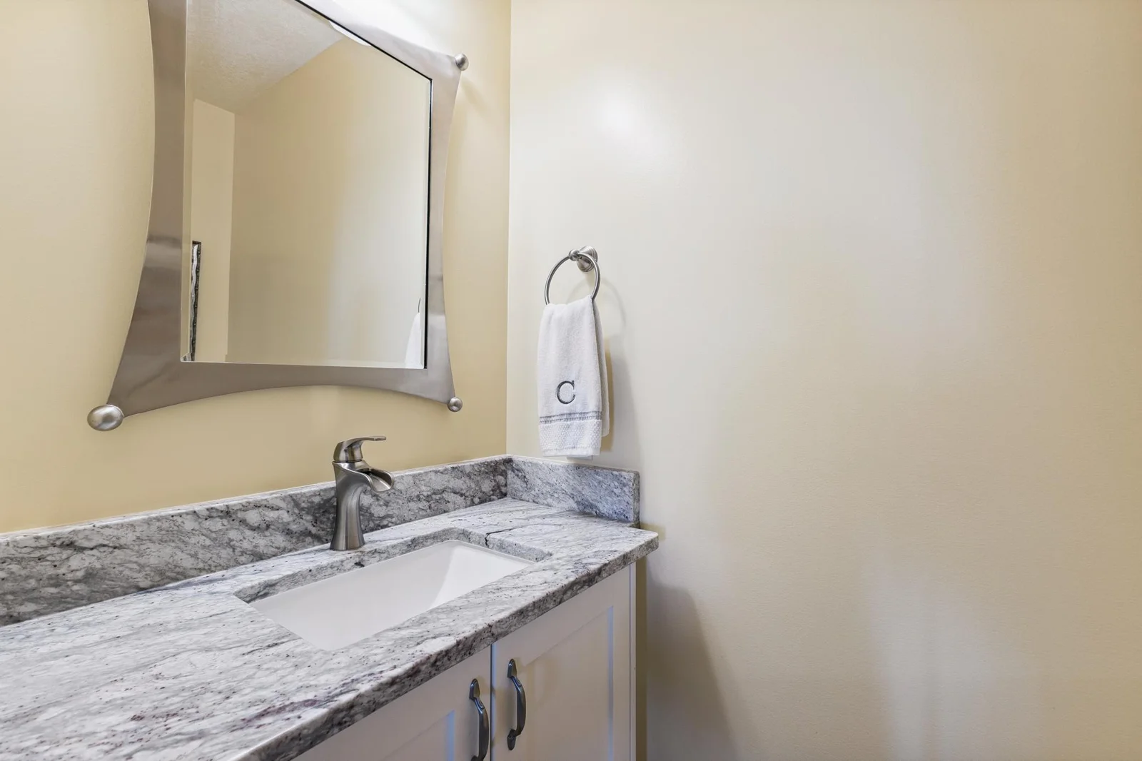 Granite in the powder room.