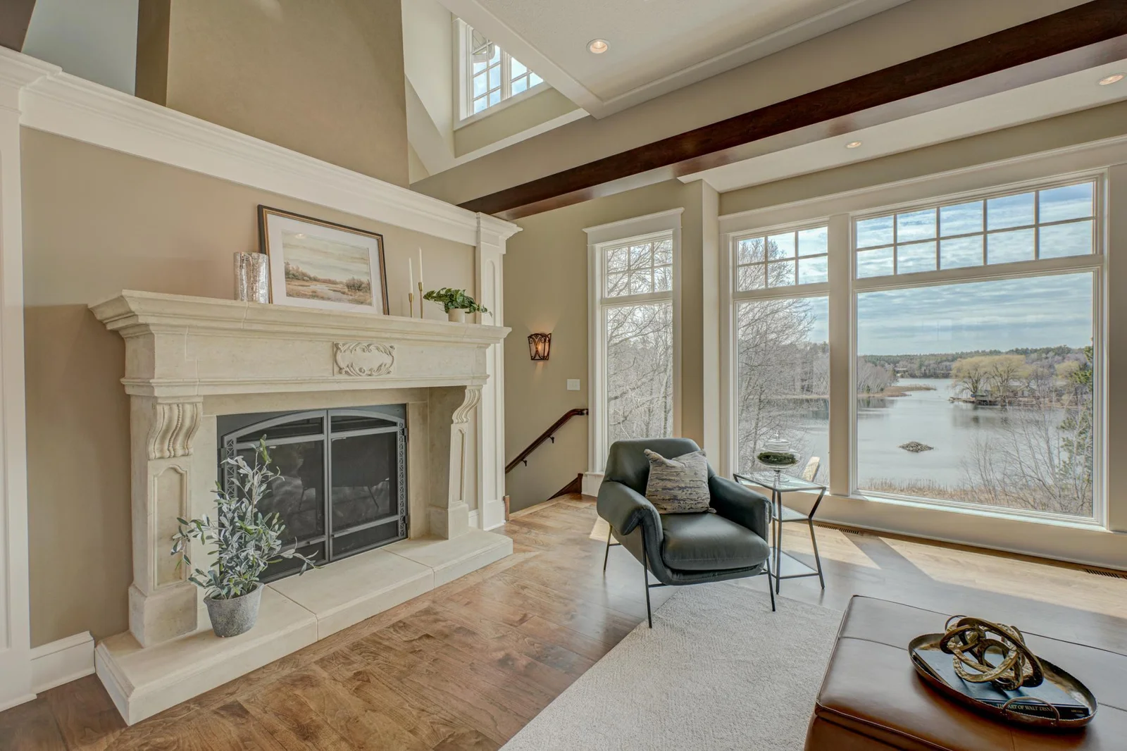 Oversized gas fireplace with custom mantle.