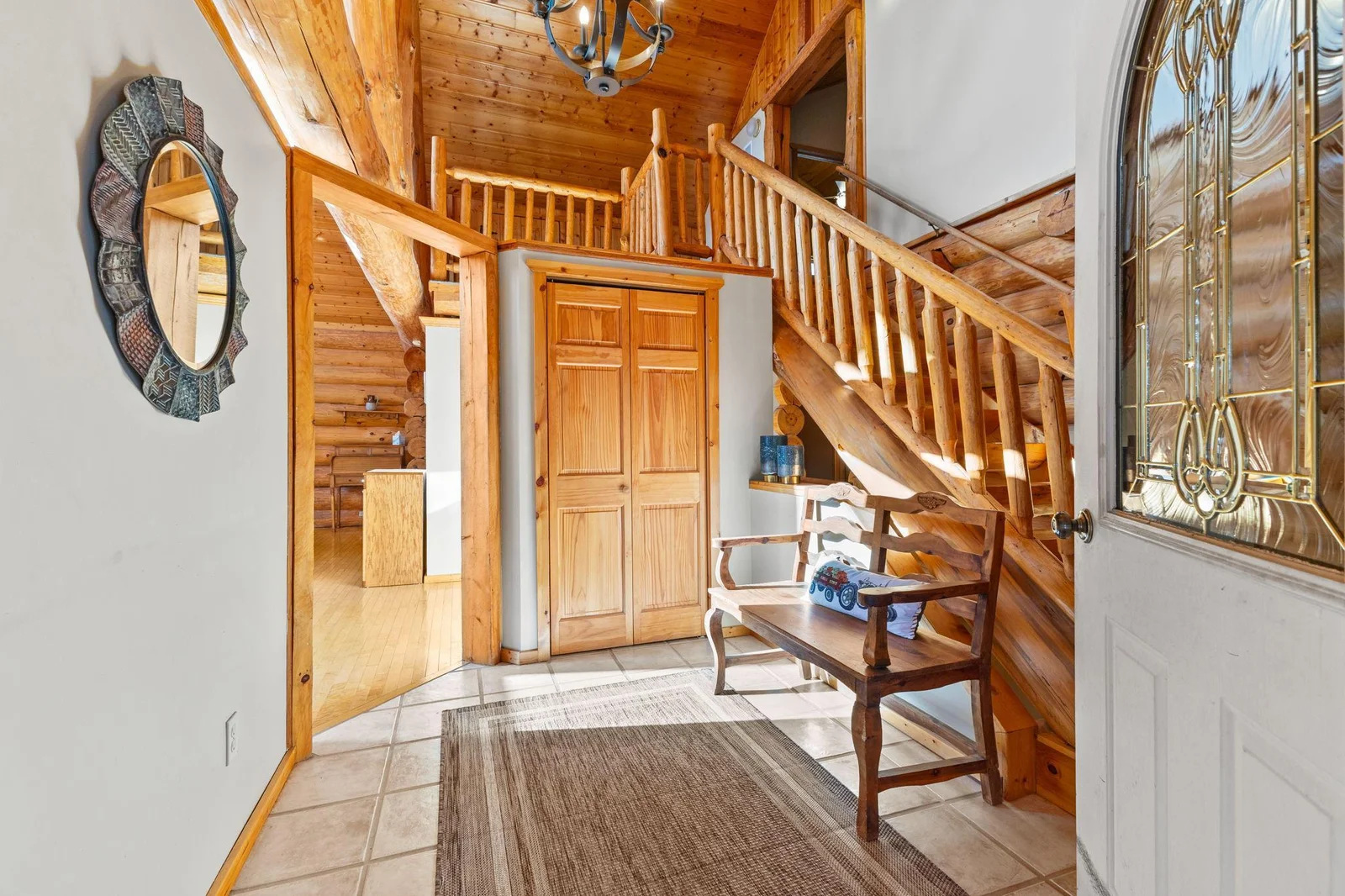 Step into the welcoming front foyer, where elegance meets functionality. This space features a beautiful ceramic floor that adds a touch of sophistication, complemented by a vaulted ceiling that creates an open and airy atmosphere.