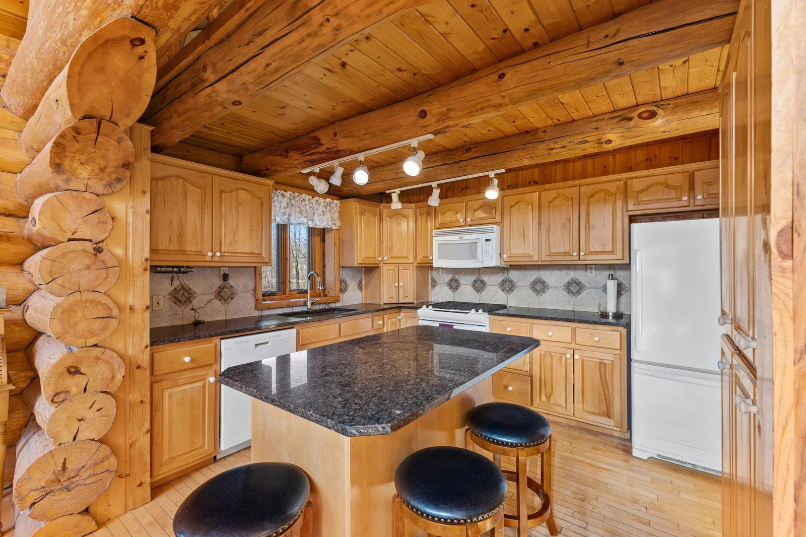 This kitchen island is not just a practical addition but also a focal point that brings the beauty of the outdoors inside.