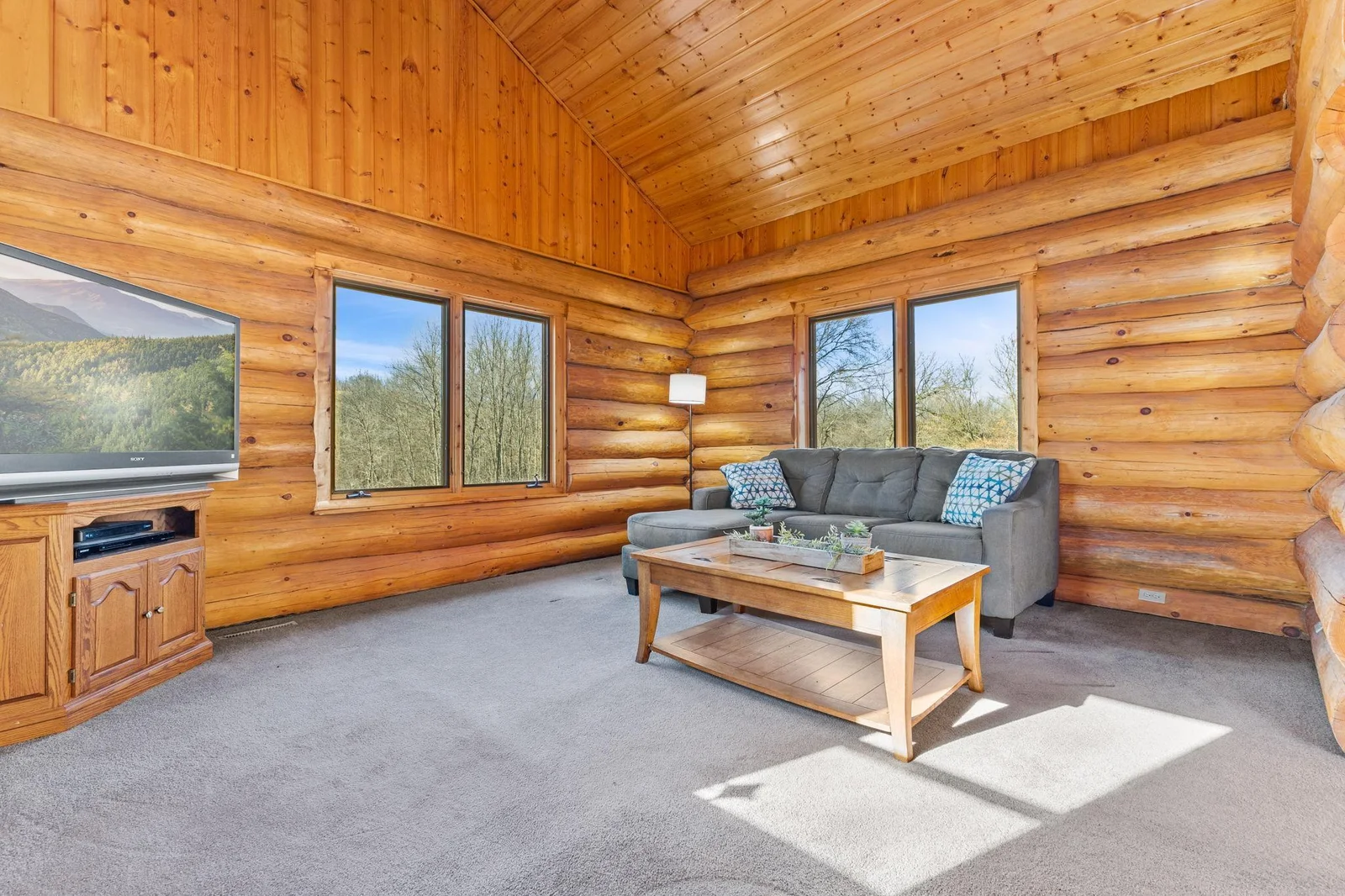 The 4 Season Porch is ideal for reading a book or watching a movie, creating a cozy retreat. Large windows that offer stunning views of the surrounding landscape.