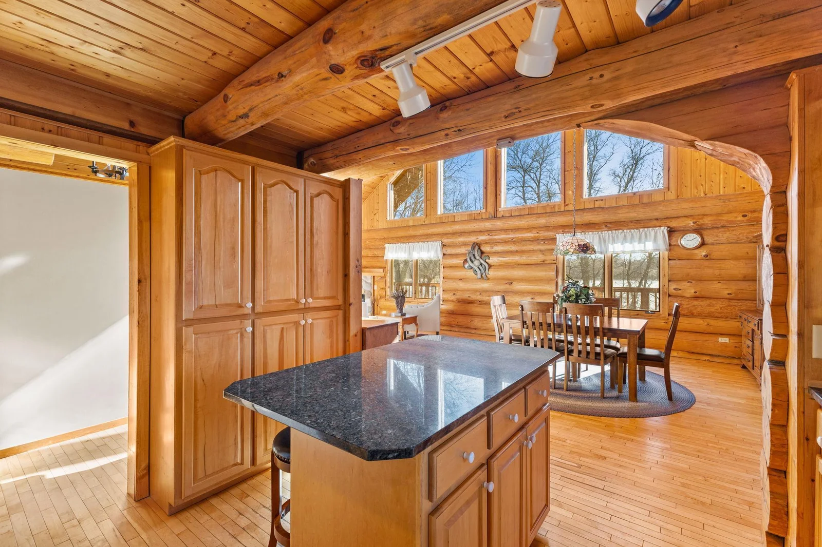 Step into this beautifully designed kitchen, where functionality meets elegance. The built-in cabinets provide ample storage space and a sleek, cohesive look. The granite countertops add a touch of luxury and durability.