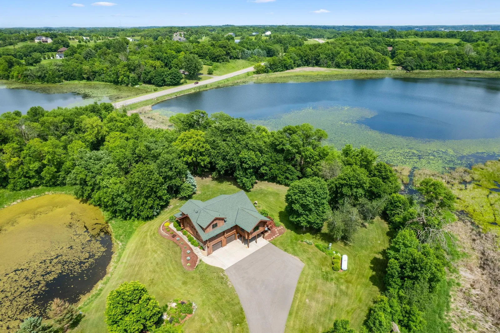 This beautiful 3-bedroom, 2-bathroom log home, featuring a cozy and rustic ambiance combined with modern conveniences. The property boasts a spacious wrap-around deck, perfect for enjoying the serene surroundings and entertaining guests.