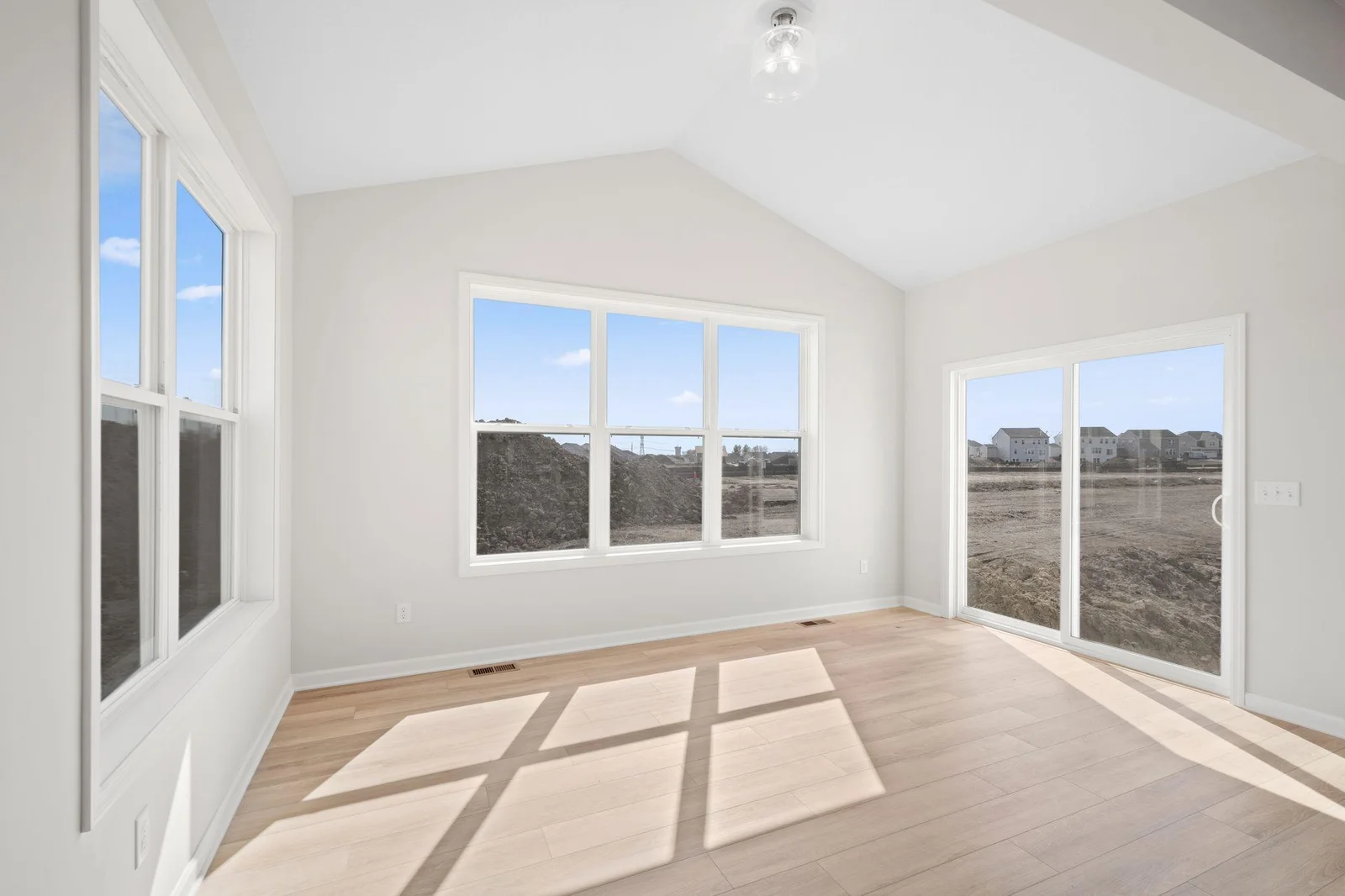 A view of the un-staged morning room for you to imagine your own furniture and style. Instead of a sitting room, make it your formal dining space.  Bring your ideas and creativity!