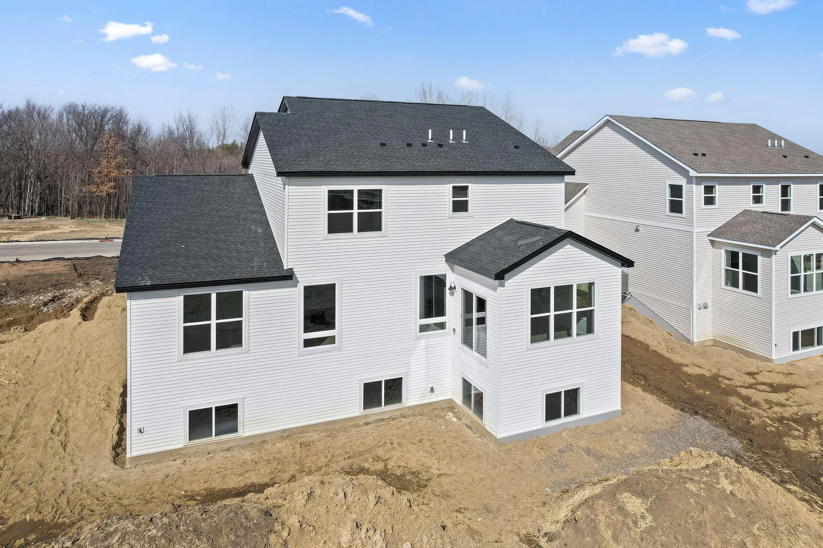Enjoy a beautiful rear view of the home showcasing a lookout basement - designed to maximize light and provide future finishing opportunities!