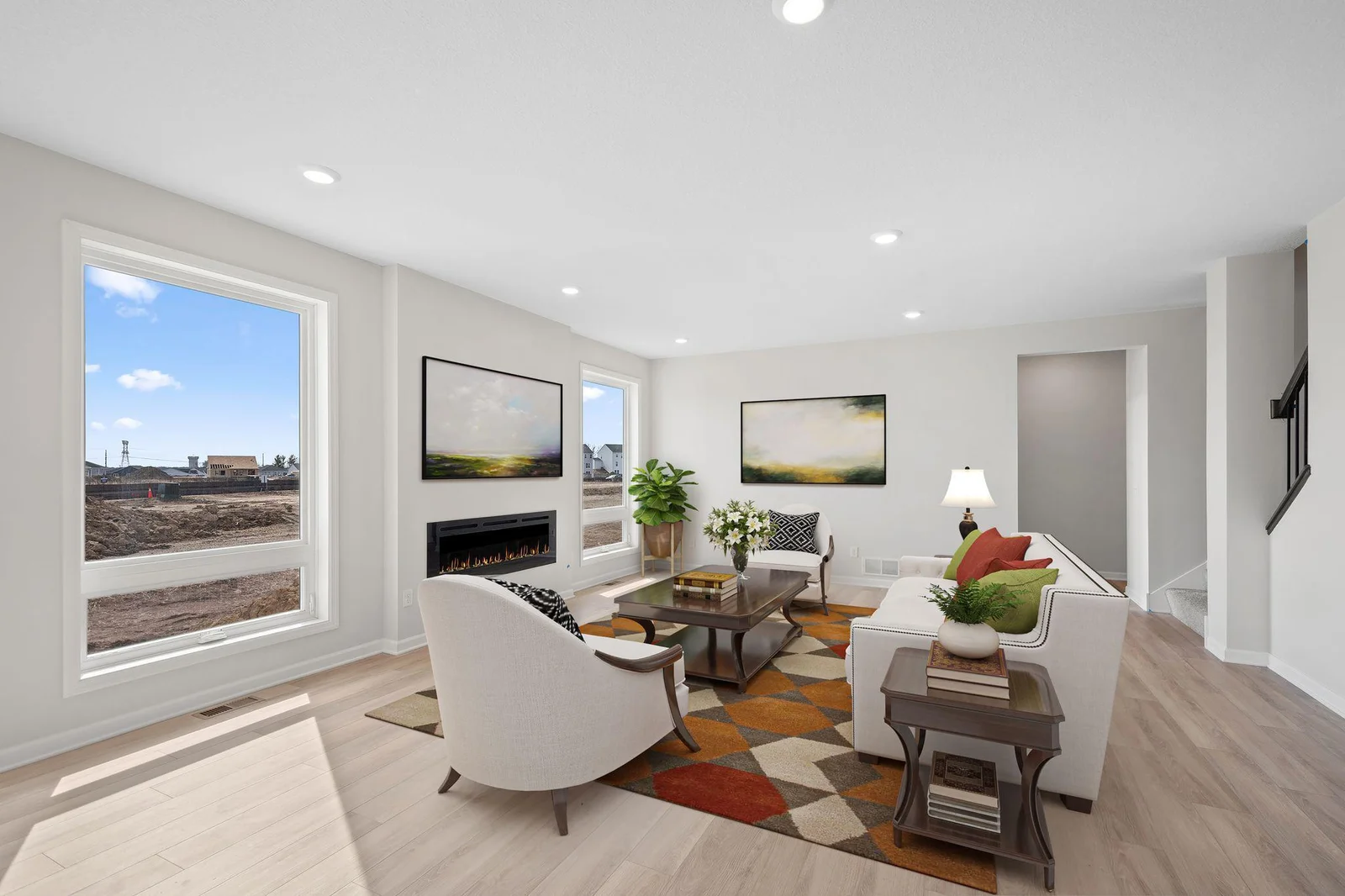 Get cozy in your spacious living room with oversized windows that shower you with an abundance of light!  (Home is virtually staged.)