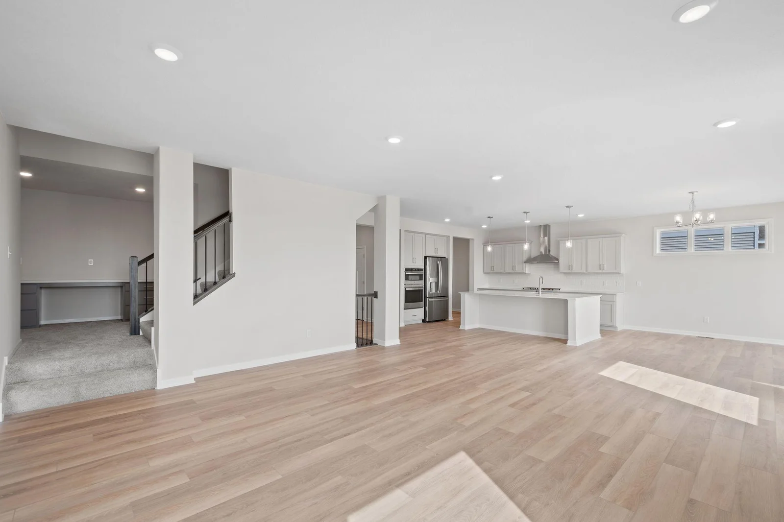 The staircase off the back of the living room leads to a convenient tech nook landing with a built-in desk.