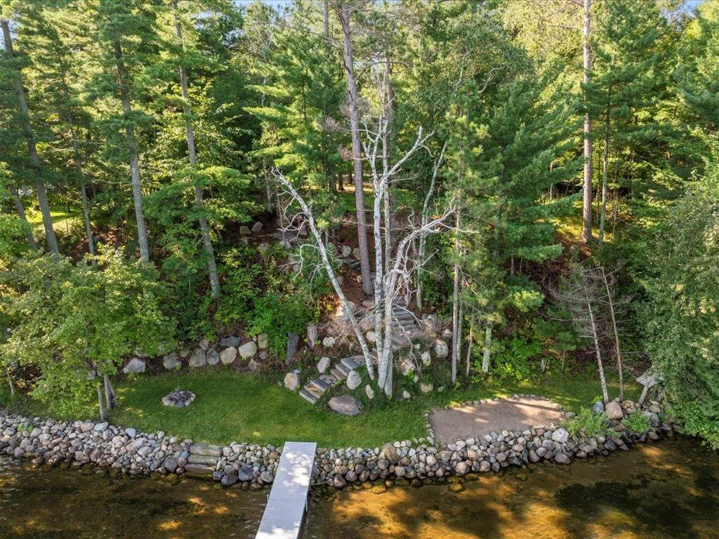 Professionally landscaped yard with sandy beach area!