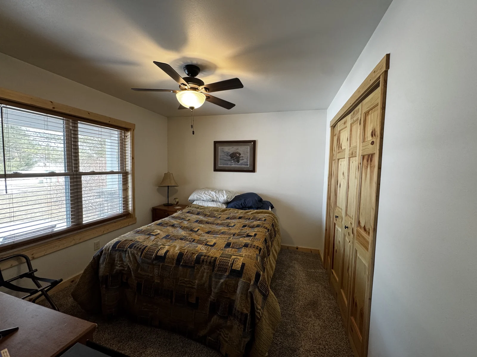 The second bedroom features a large closet and large windows for natural light.