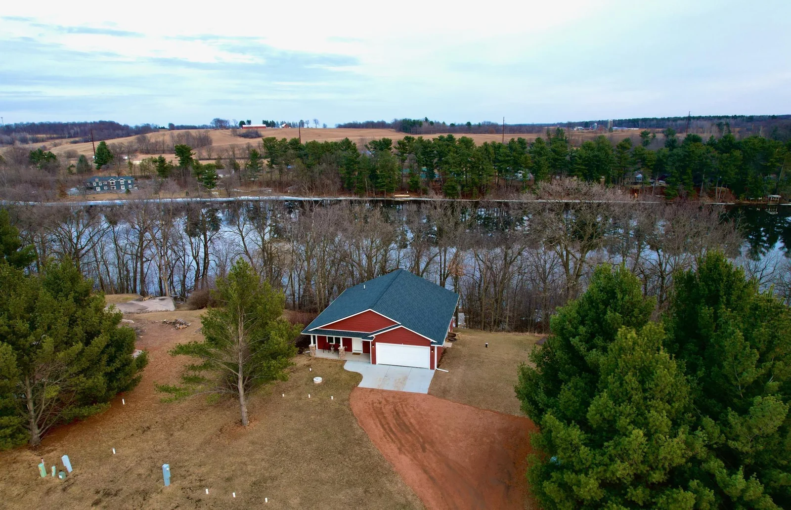 An aerial of the property with river behind the house.