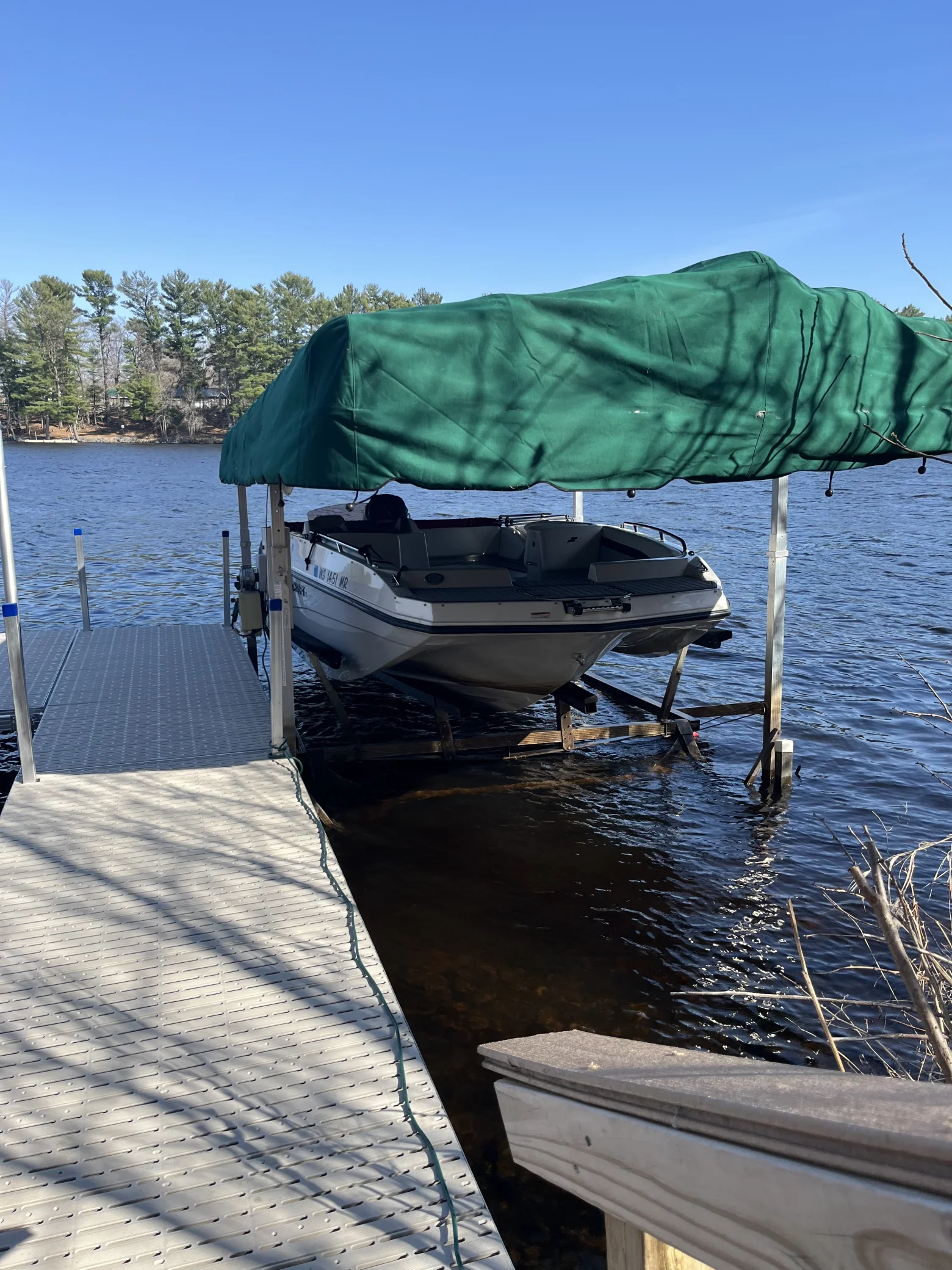 The property features a boat lift for quick access to the water.
