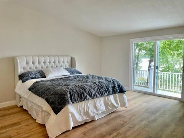 15-Bedroom 2 - lake view and walk out to lakeside deck (2).jpg