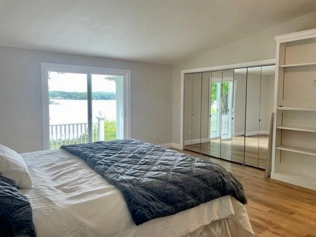 15-Bedroom 2 - lake view and walk out to lakeside deck (1).jpg