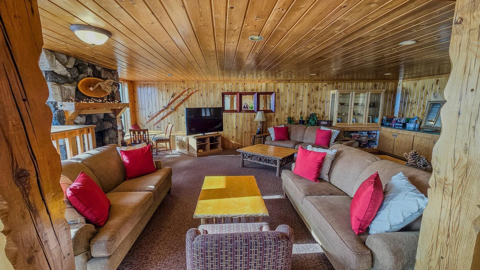 Main lobby with cozy seating, an electric fireplace and Dish TV