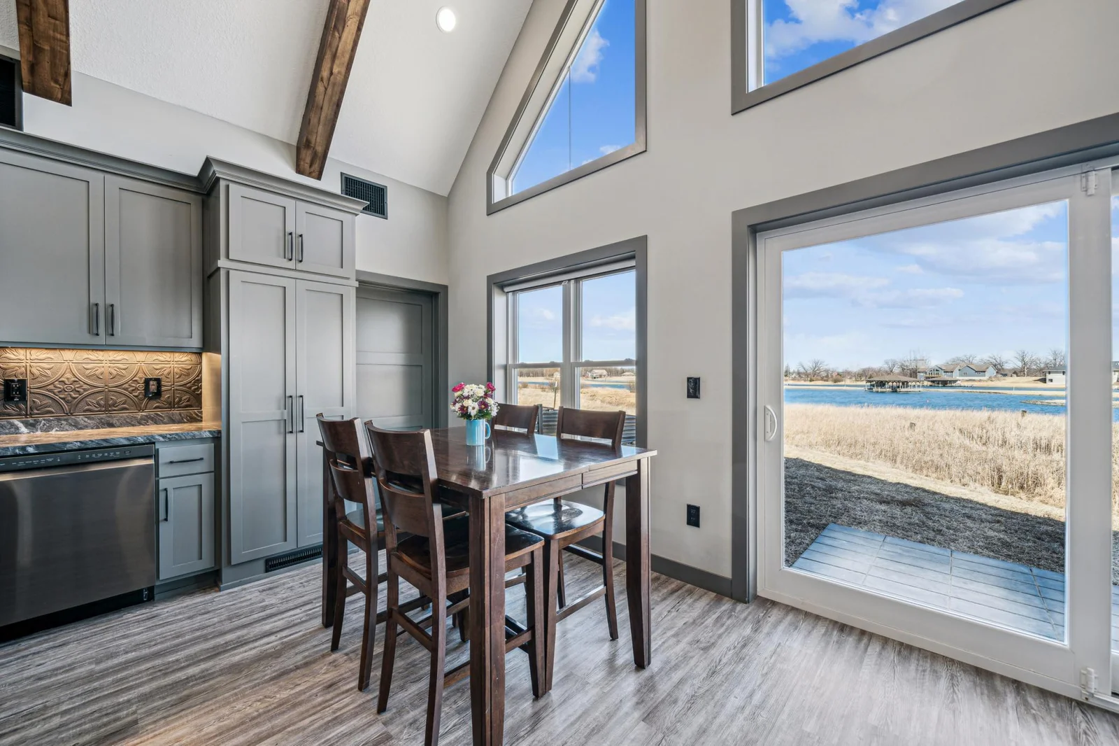 Dining area with large Panty cabinet next to utility storage room