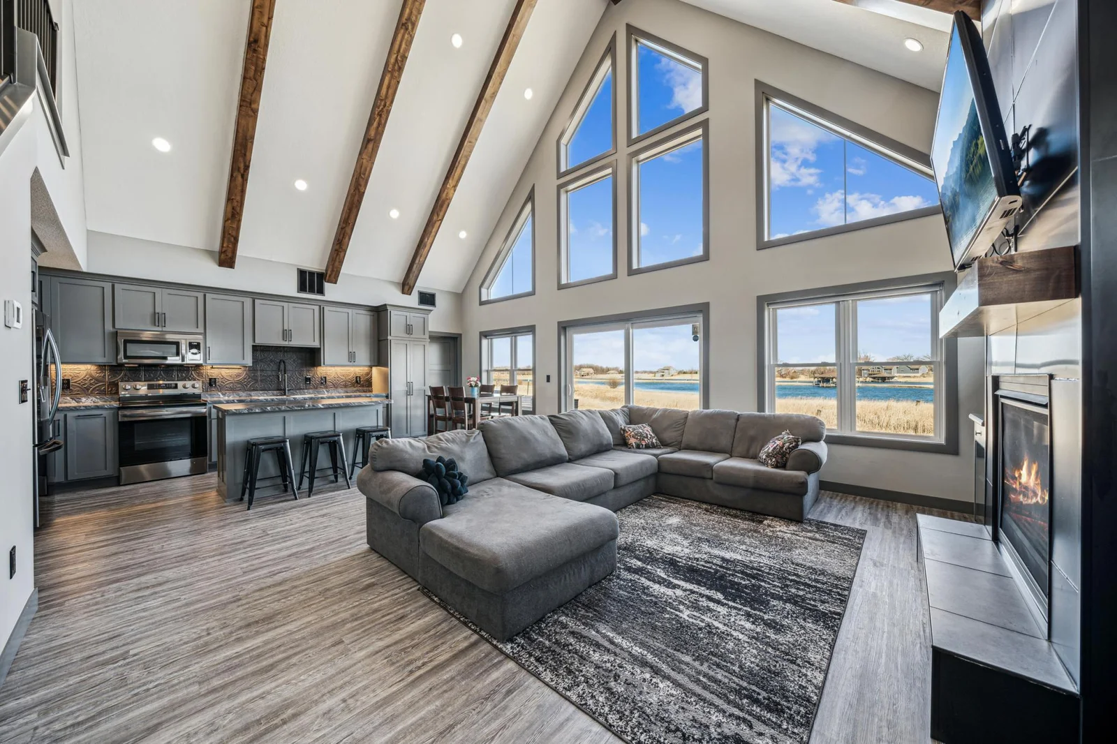 Living Room, Kitchen w/windows all the way up to the 24' peak