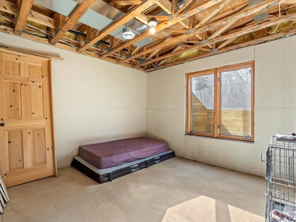 Lower level extra room that could be finished off as a bedroom or office.