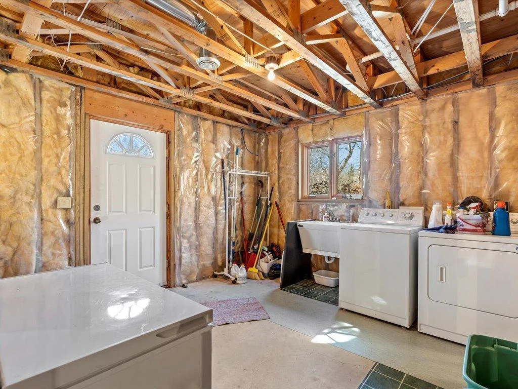 Lower level laundry room with outside access.