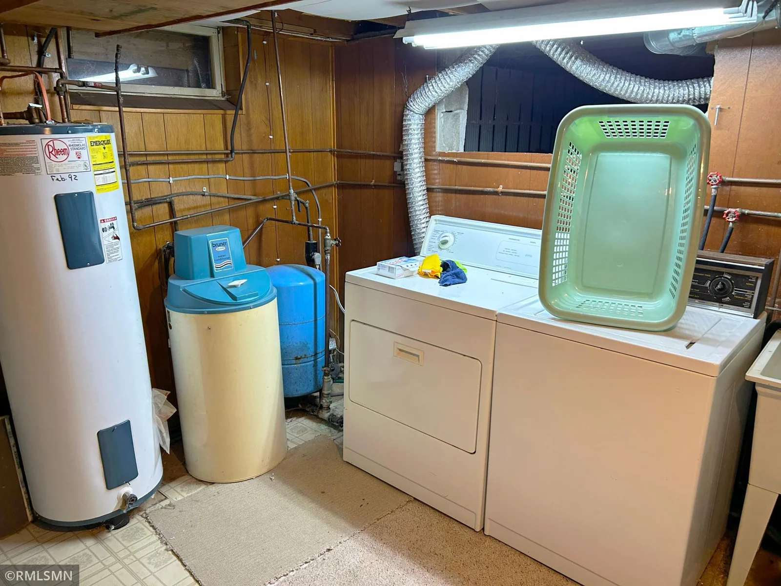 Laundry in lower level utility room off bathroom.