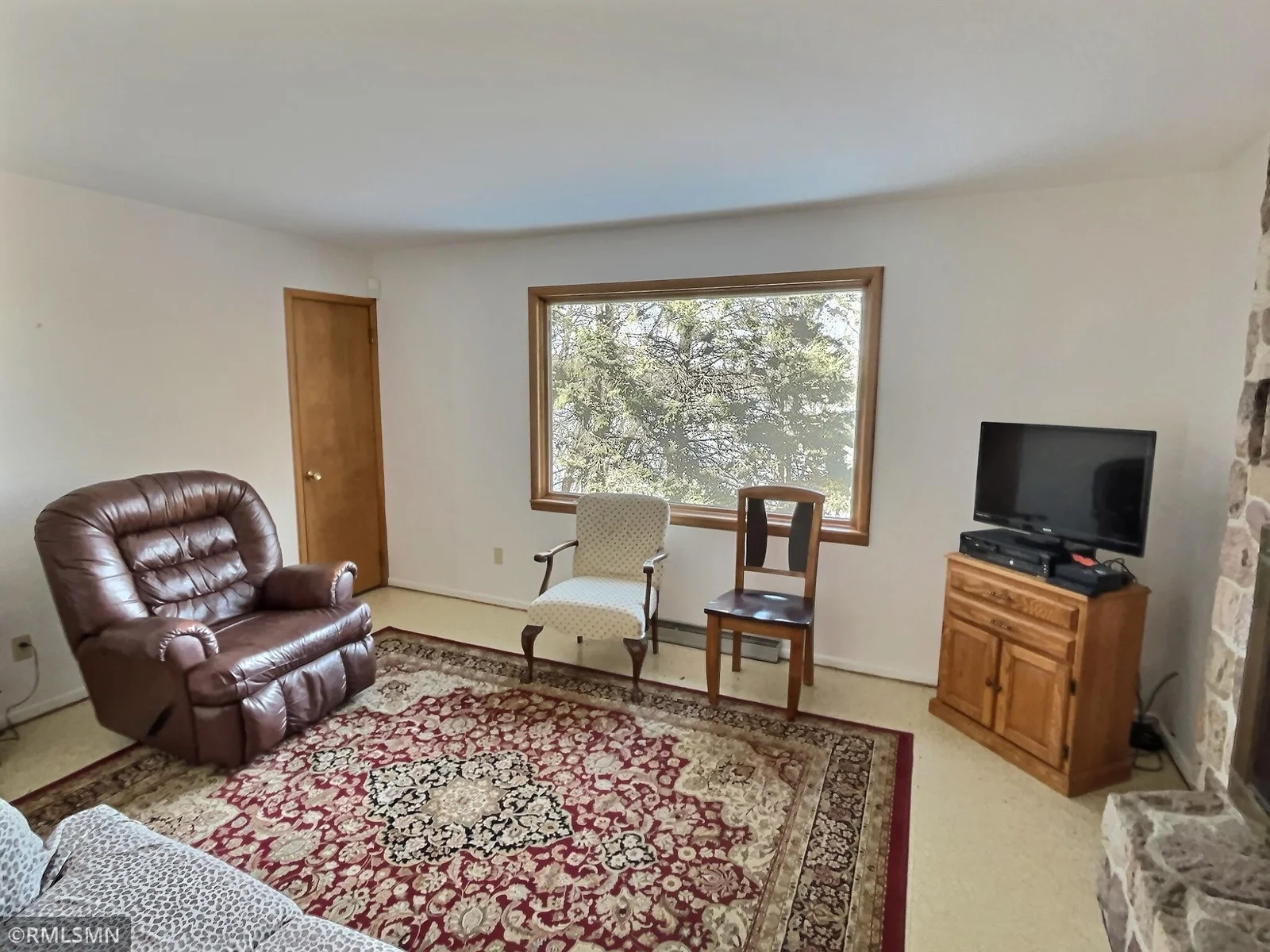 Another angle of the living room with great views of the lake, woods, and willife that are abundant.