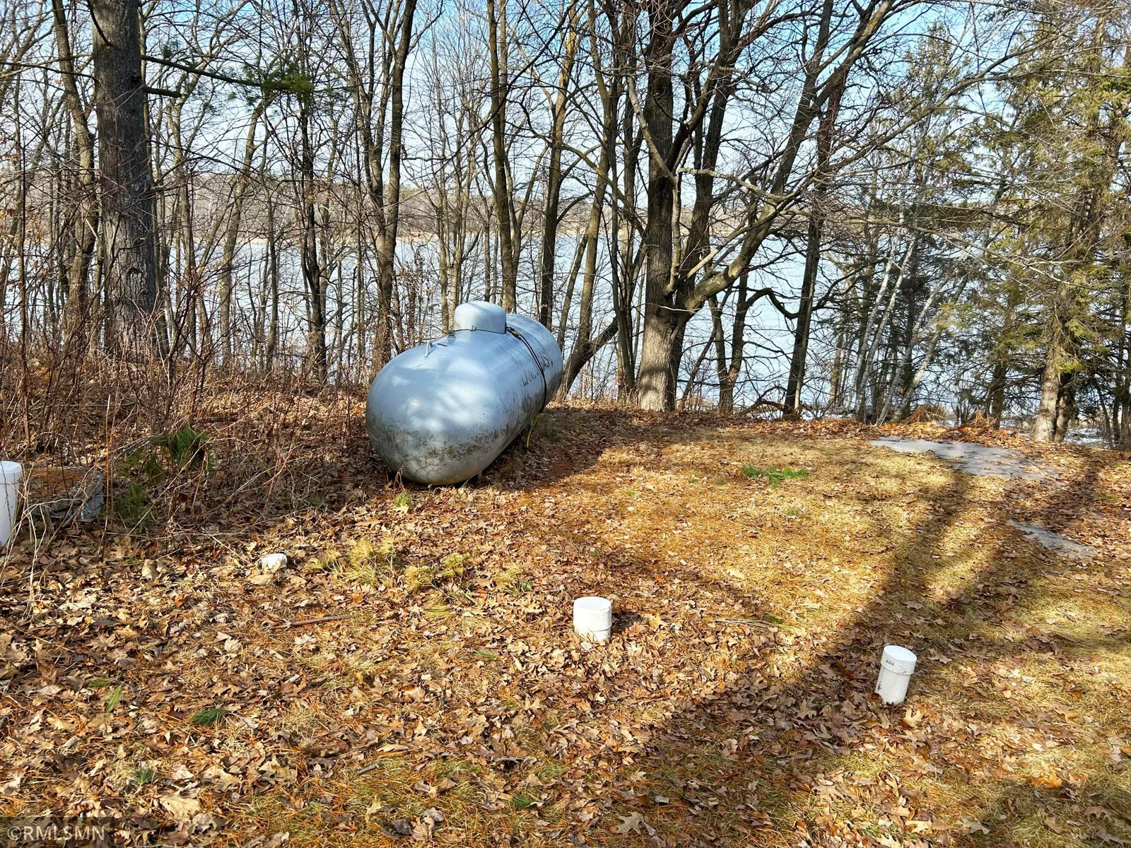 Picture of propane tank and existing drain field.