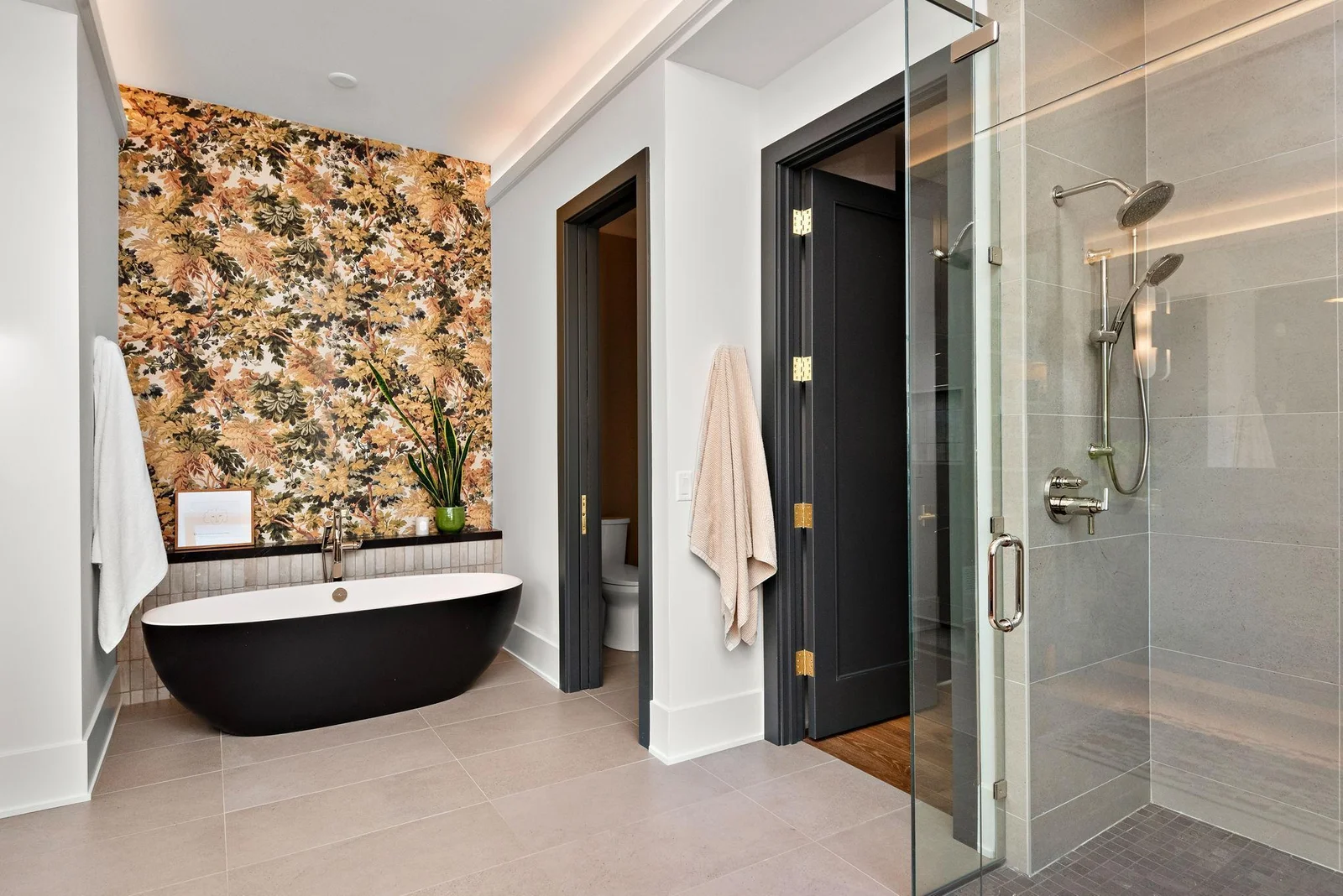 Both the Primary Suite and LL Jr Suite feature Victoria & Albert 66" soaking tubs, heated floors, and walk-in showers dressed in Hansgrohe hardware