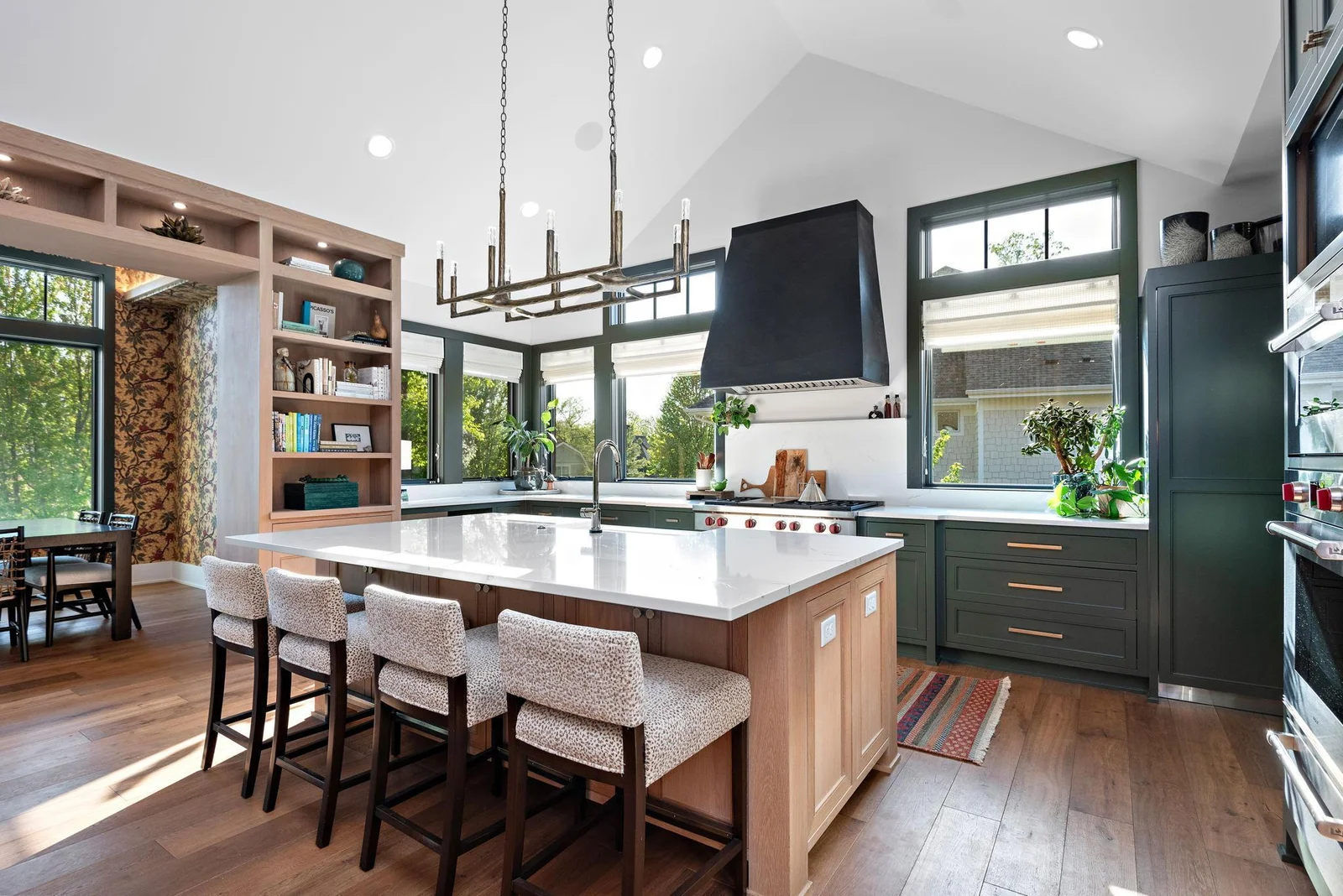 You'll find 8" wide-plank engineered white oak flooring throughout the main-floor common areas, save the Family Foyer and the Sophisticate's Retreat, which is set atop 16" x 32" Limestone Taupe Tile.