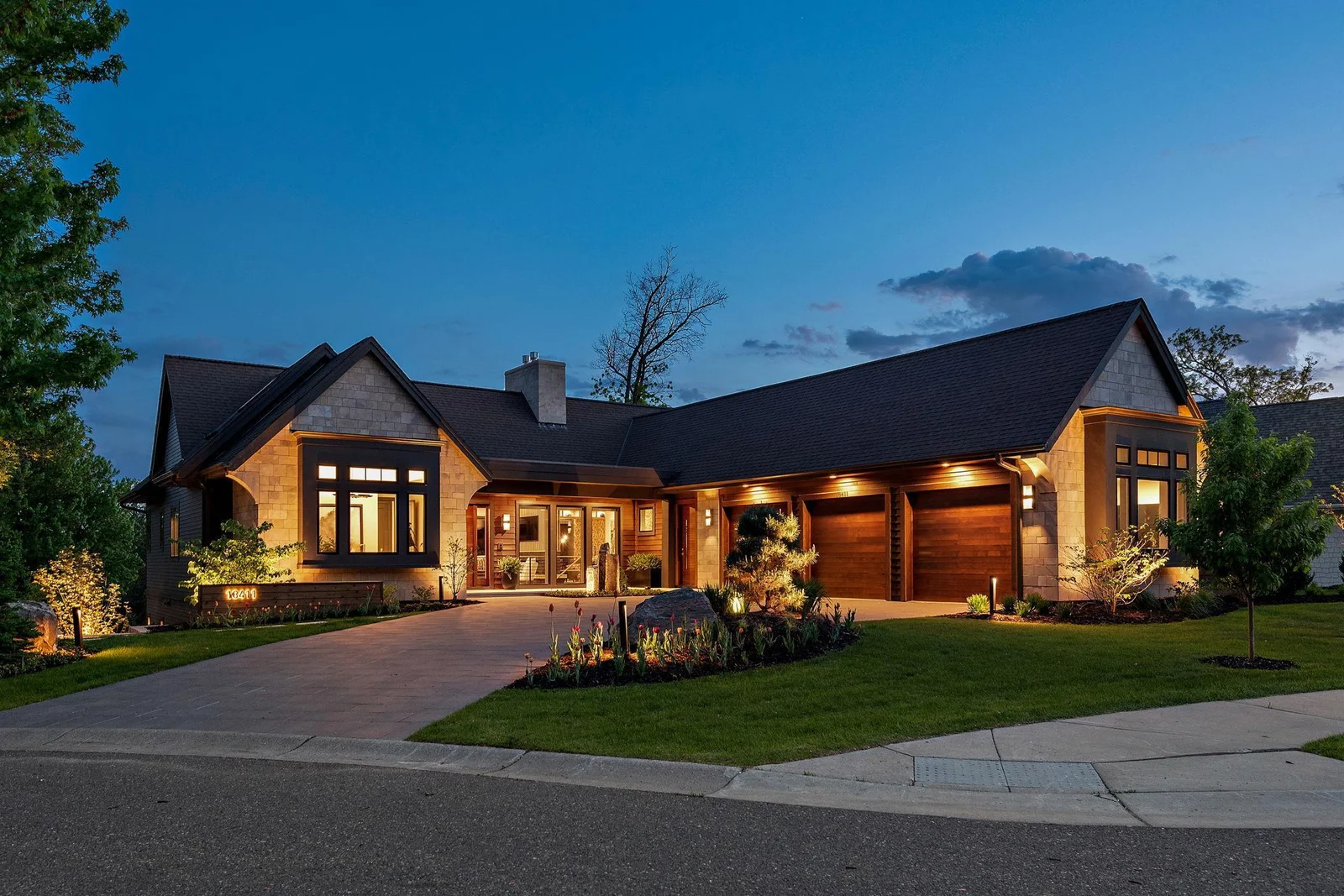 The 942 TFSF Heated & plumbed garage is wired for two EV charging stations, and features a pet wash station, epoxy flooring and drains, three app-controllable 8 ft garage doors, Sonos system, and Lutron shades