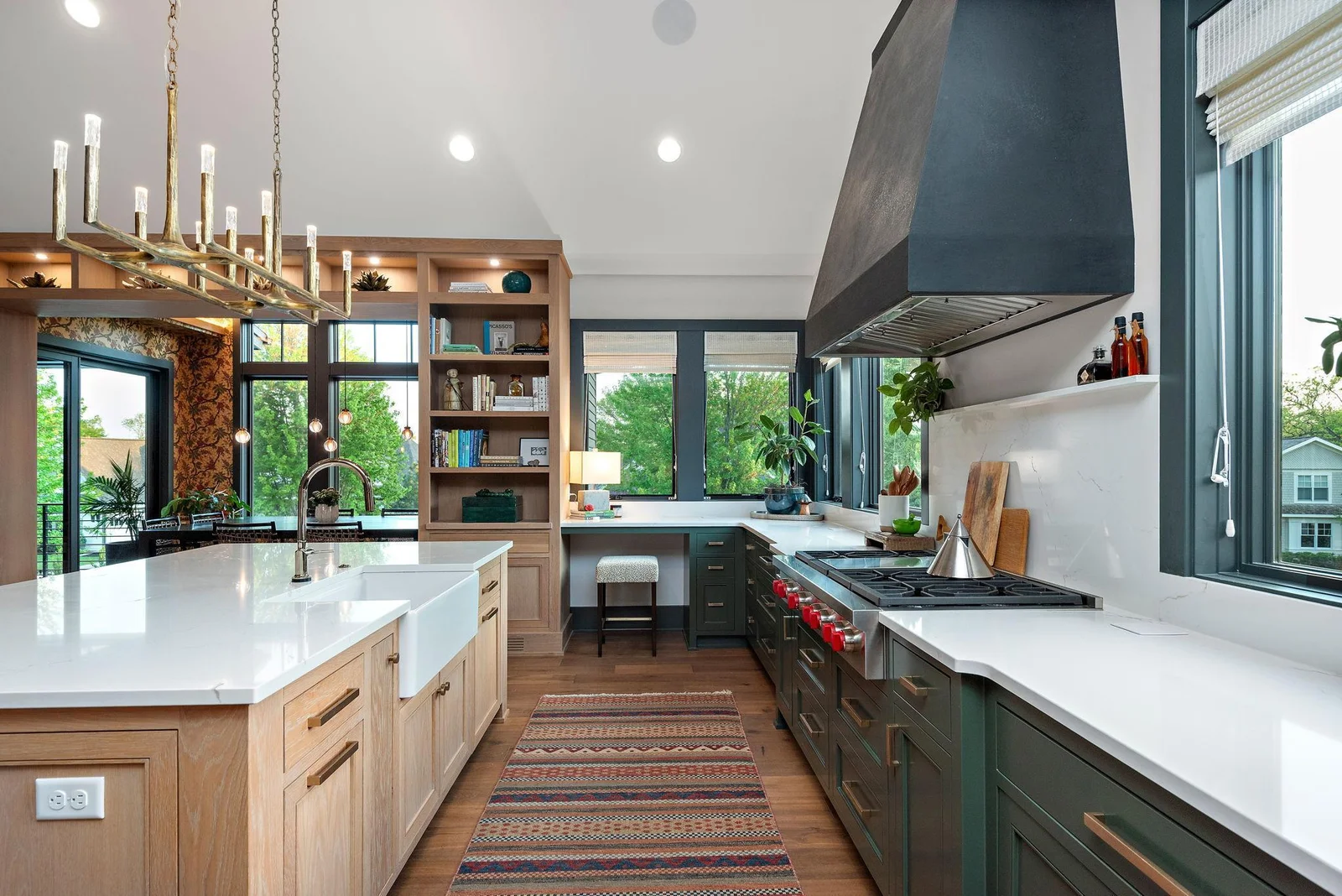 Notice the Seamless Countertop Power Hubs: They blend in and are built into the countertop for a streamlined appearance. - Loving the backsplash shelf above the Wolf, perfect for storing items like spices, oils, and condiments.