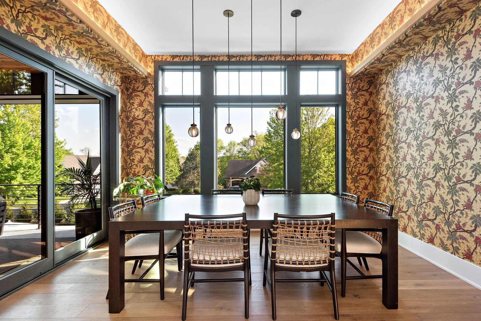 The dining room is dressed in cove lighting and a showpiece worthy multi-pendant chandelier. This room conveniently adjourns directly to the covered terrace overlooking the pool and entertainment area.