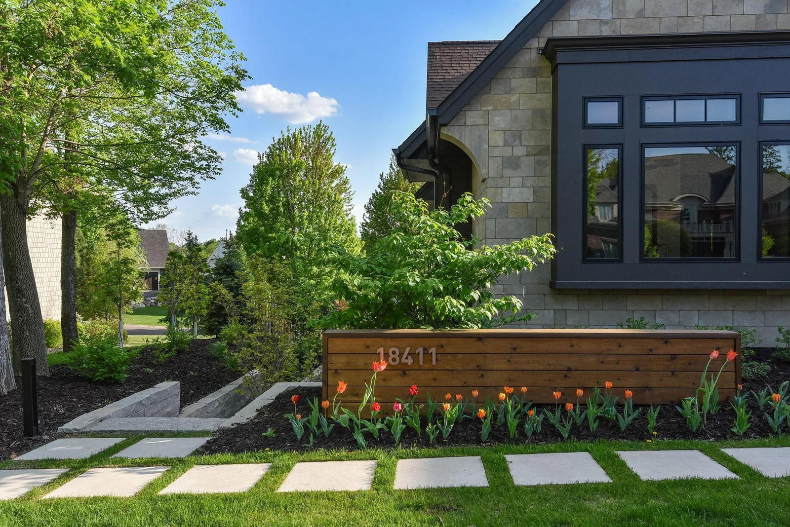 The eastern side of the estate is dressed in an extraordinary corridor of Fond du lac stone - leading to the pool and serenity deck. Traversing this exquisite space is as if one has been transported to the grounds of our famed Walker Art Center.
