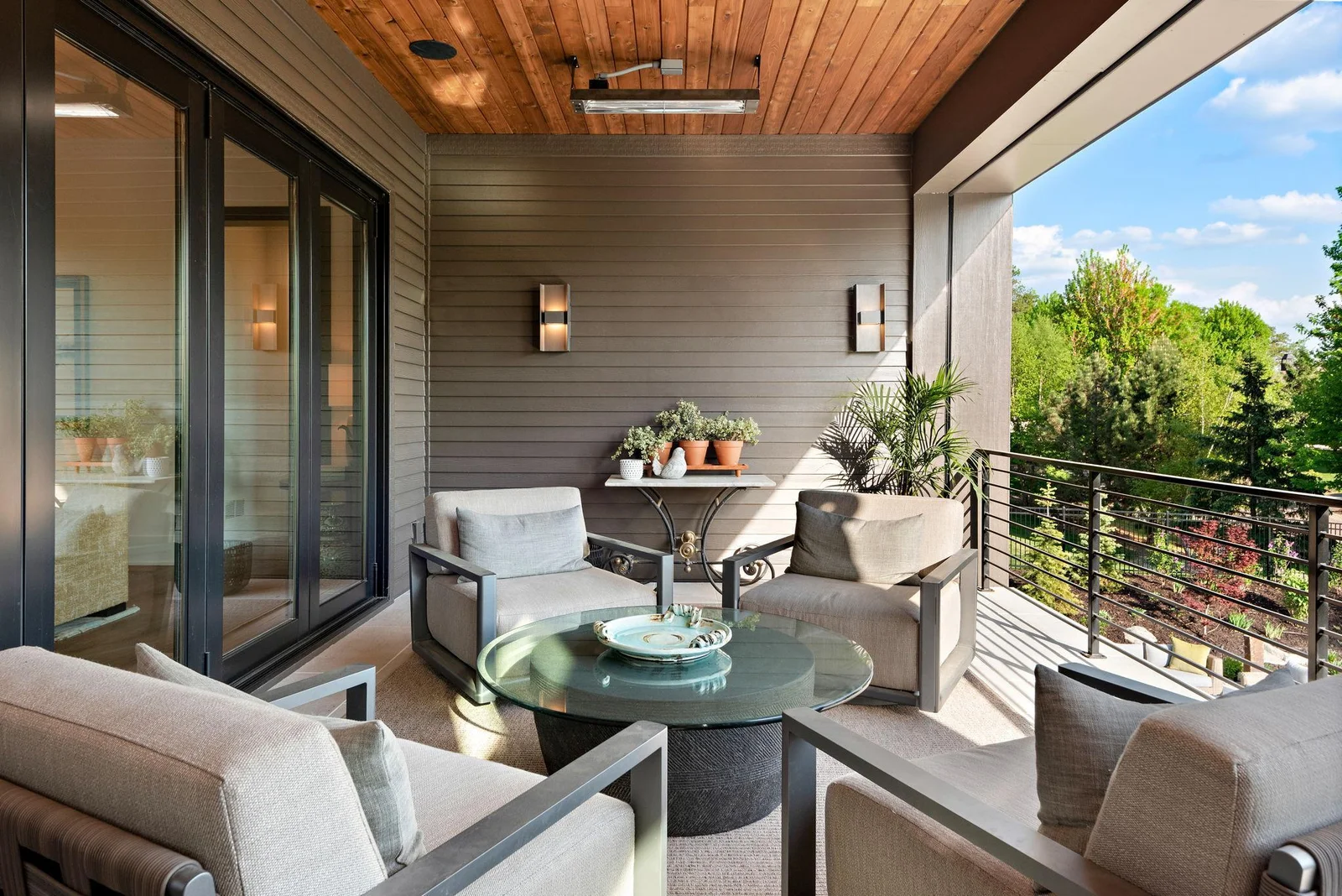 Retractable phantom screen and 15 x 8 5-panel Bi-folding door system seamlessly transforms the heated, covered terrace into an additional 312 sq/ft of indoor/outdoor living space.