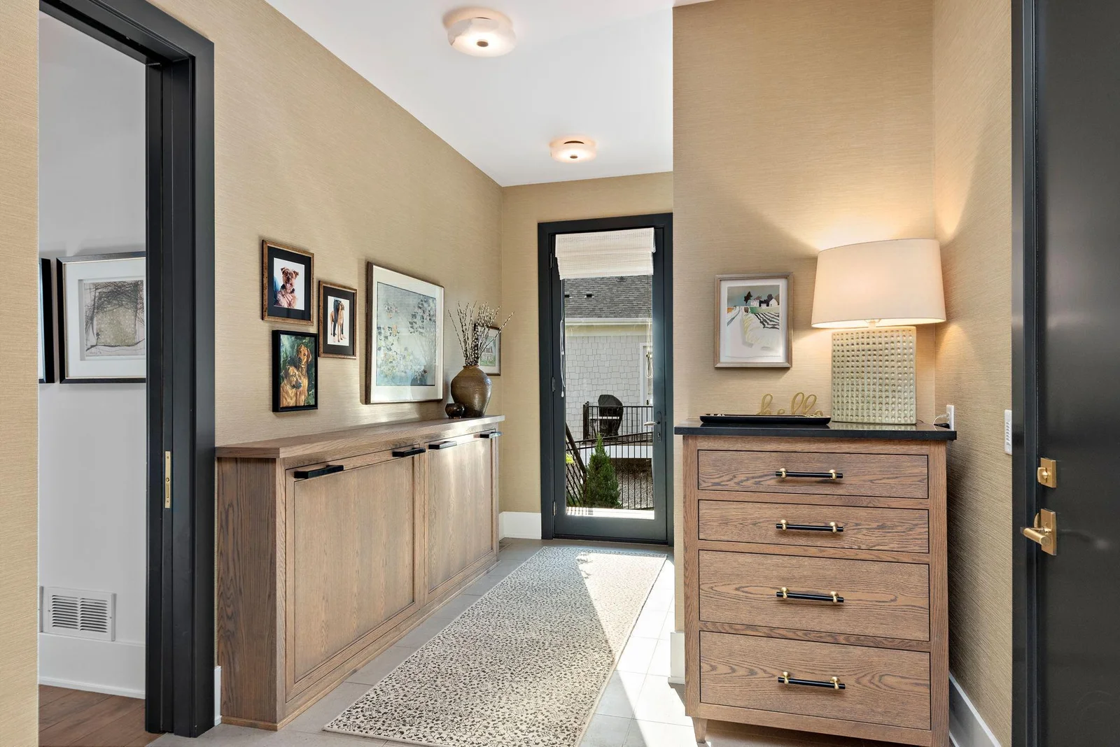 Every practical scenario was considered in this well appointed Family Foyer. From the walk-in storage closet to dual drop down doggie beds - The grill deck is just beyond the full view door. One can access the garage and front service entry here.