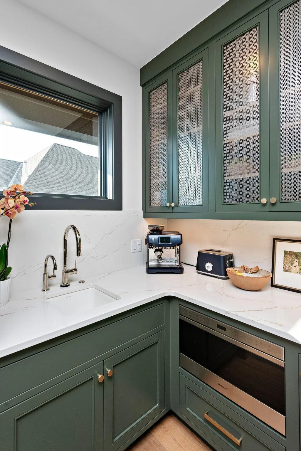 The grandeur of your chef's kitchen is not lost in the next-level scullery, complete w/ dedicated sink w/ RO, garbage disposal #2, appliance garage, and floor-to-ceiling storage. Cambria Quartz counters preserves the 8x5 island as a statement piece!