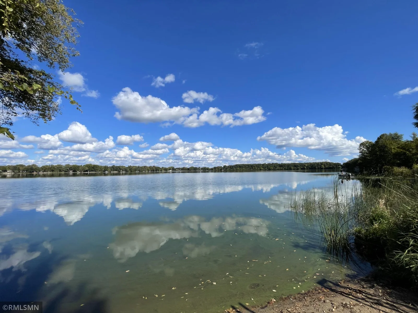 Beach area about 40 feet, maintained by the sellers. 54 foot aluminum roll in dock will stay with property.