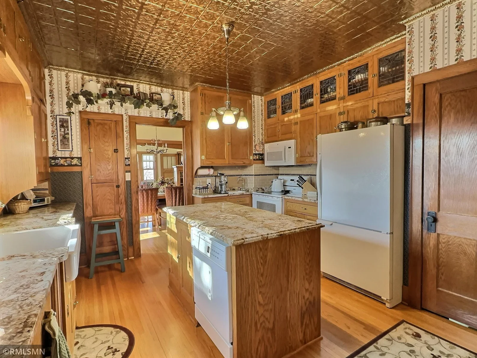 This beautiful kitchen has been remodeled with details, down to the tin ceiling.