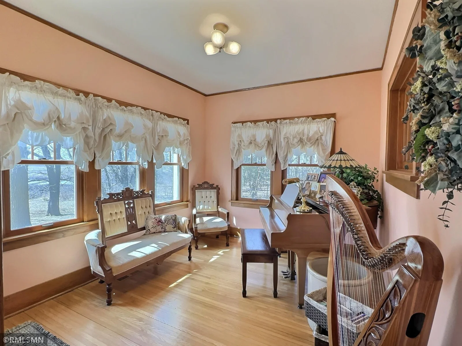 Sunroom is bright and full of windows. Peaceful space to enjoy your morning coffee, or relax to music.