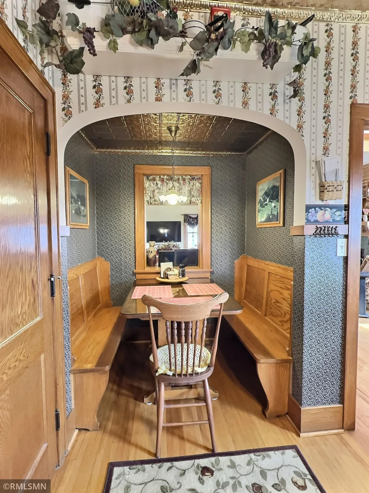 This fun breakfast nook is true to it's time, and was restored in 1998. The window was originally an exterior window before the addtion.