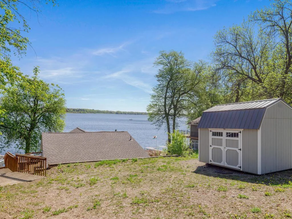 Storage Shed And Gravel Parking Area Above The Lake Home