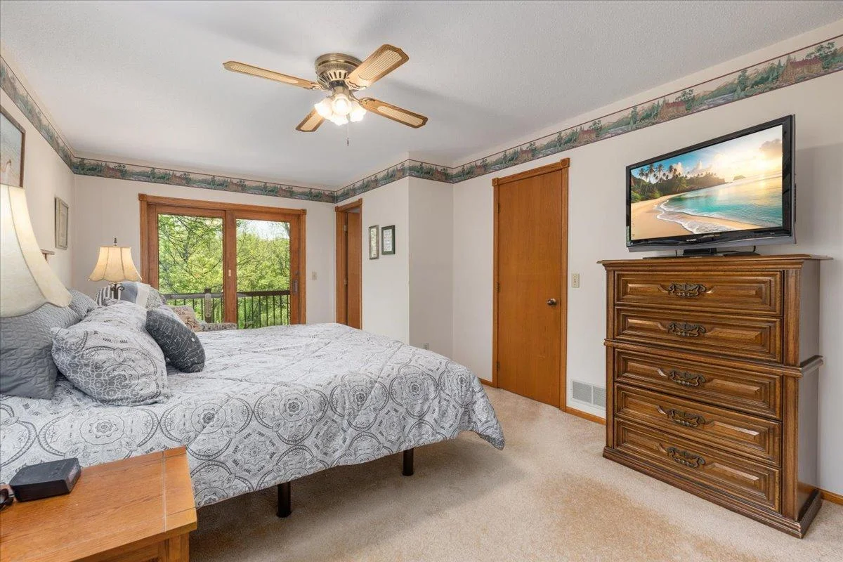Primary suite with walk-in closet and private bathroom