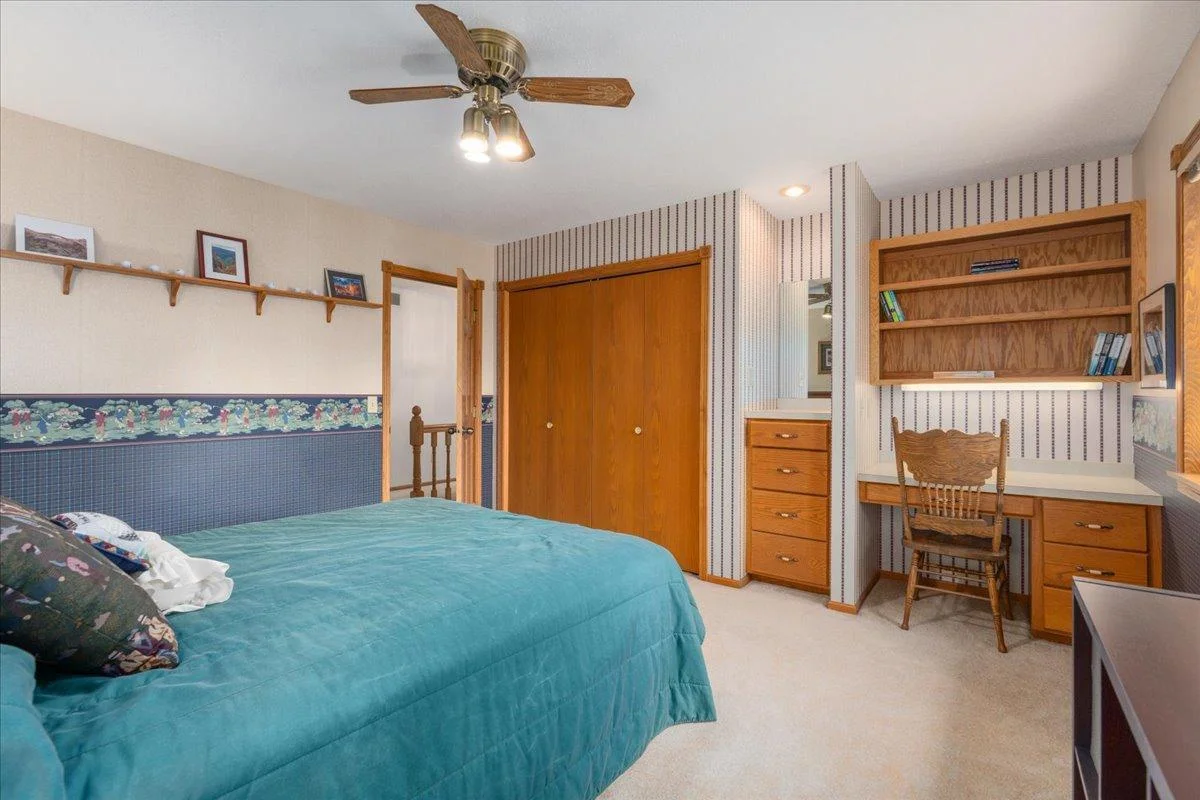 Upper level bedroom with built-in and desk area perfect for studying