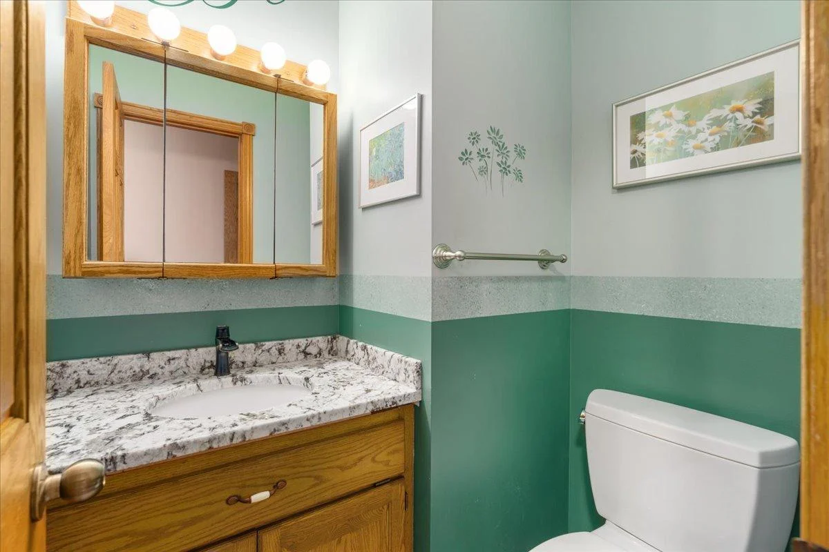 Main floor half bath with granite countertop