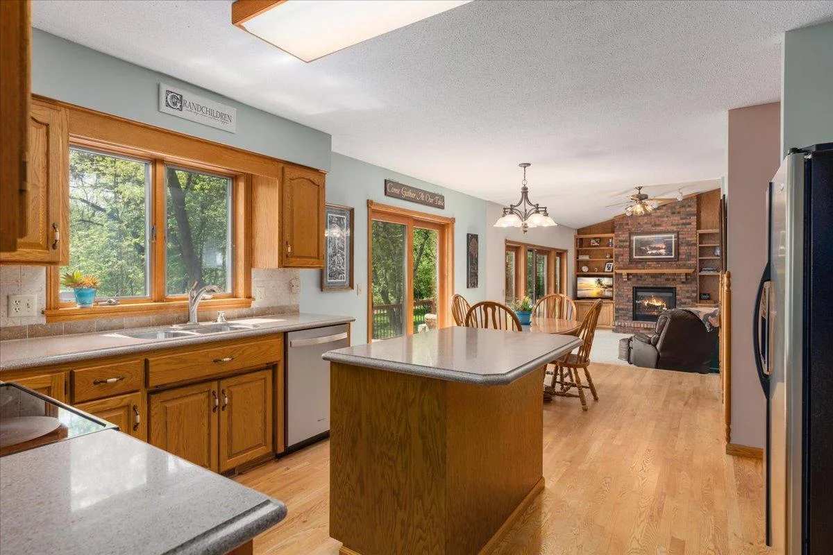 Sun filled kitchen with granite countertops