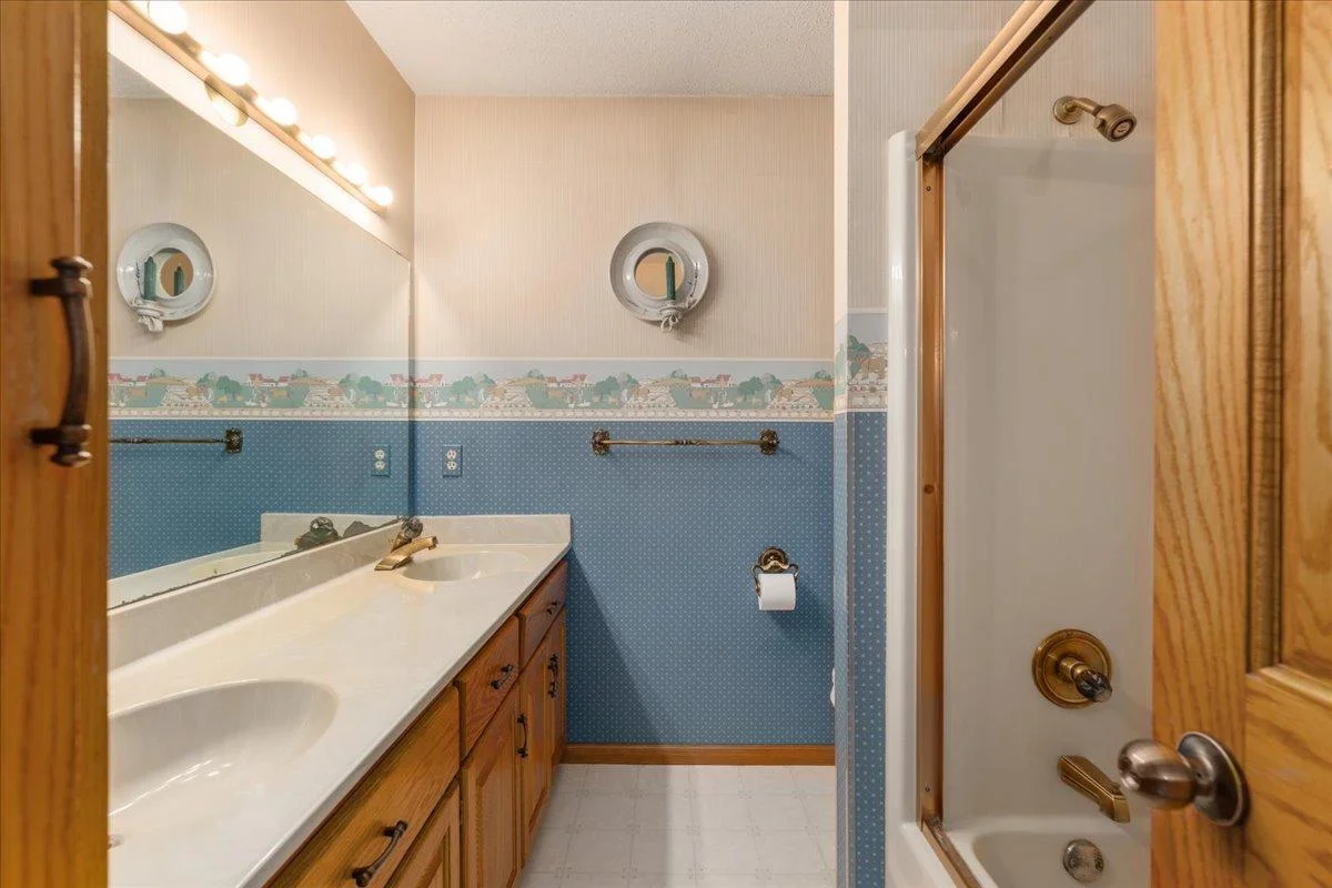 Upper level family bathroom with double sinks