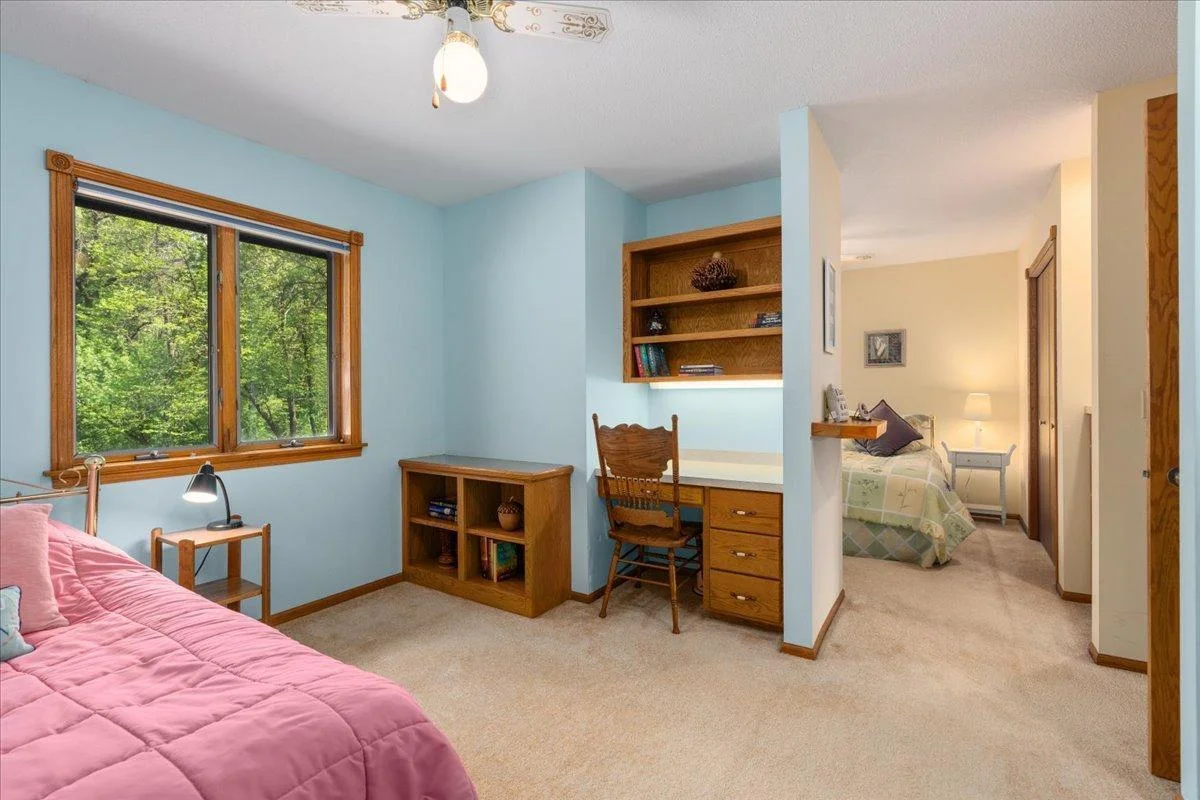 Upper level twin bedroom with built in desk