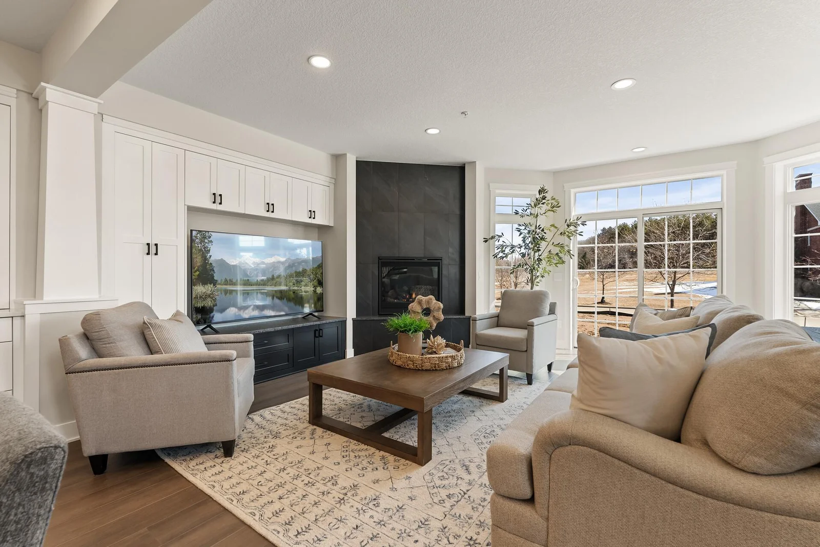 Living Room 1 with Built-In Storage and access to patio